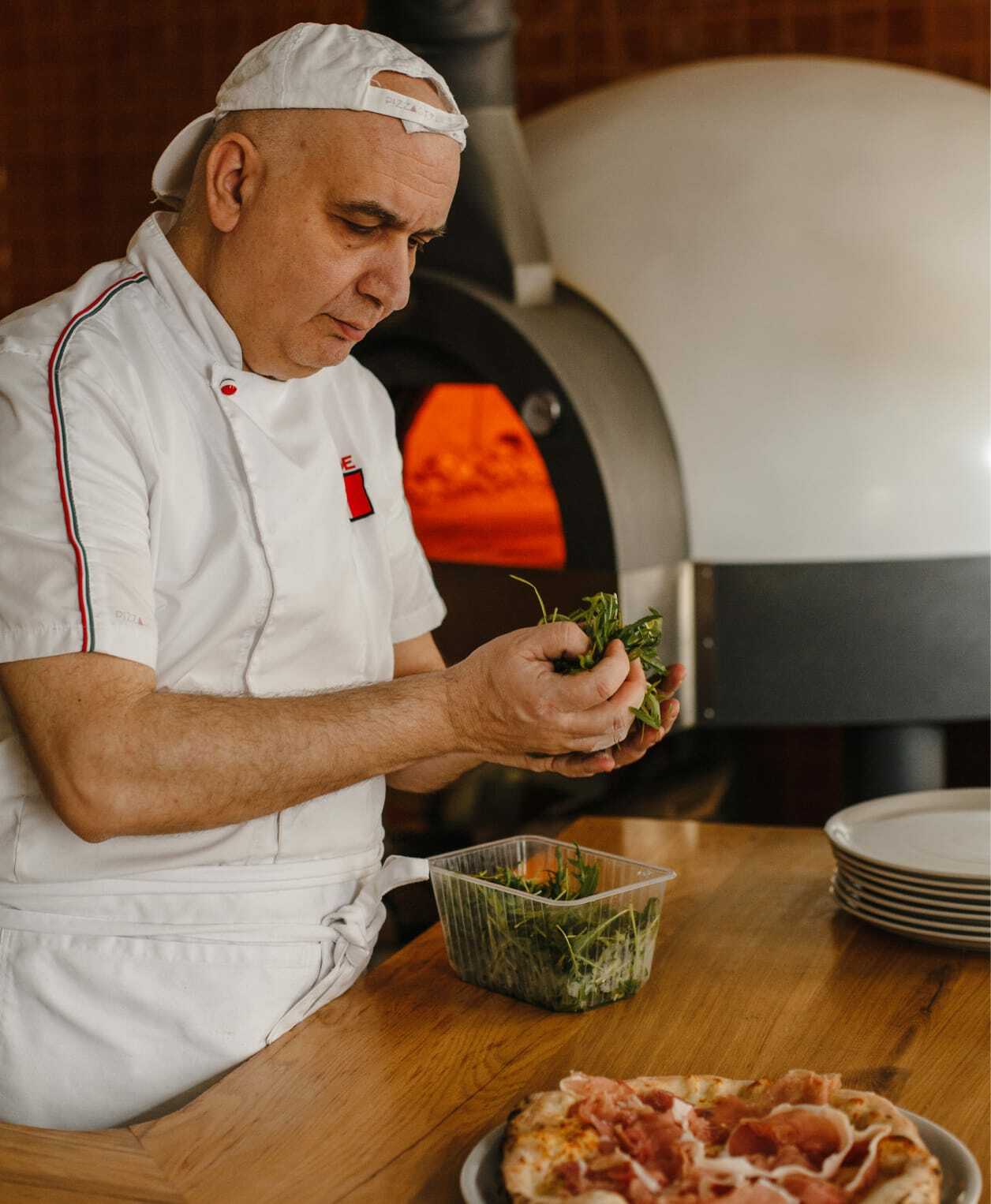 The daily craft behind every pizza - from the chef's hands to the table